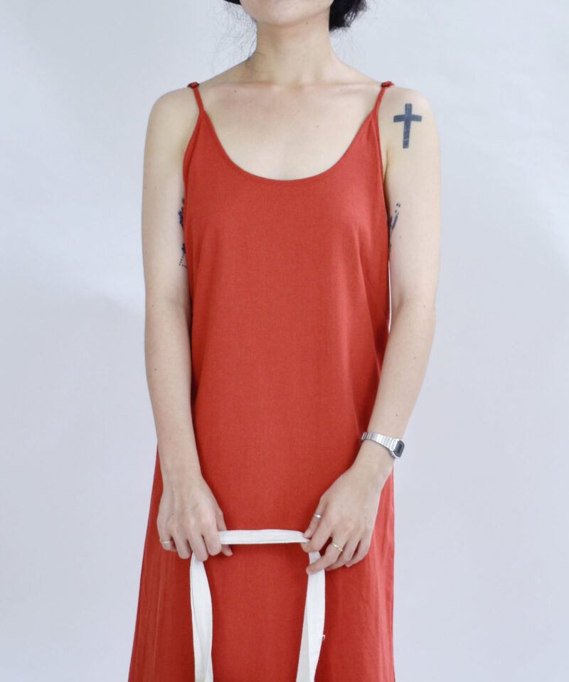 Breezy and bold, this open-back red linen slip dress is crafted from soft, breathable fabric that floats effortlessly. The plunging V-back design adds a touch of quiet sensuality, perfect for summer strolls or beachside days. Lightweight and flowy, it captures the essence of carefree elegance.