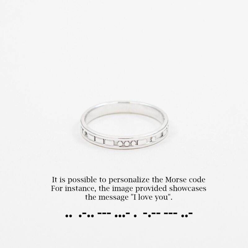 A delicate sterling silver ring engraved with Morse code that spells "I love you", elegantly displayed on a white background. The clean composition highlights the minimalist design and the meaningful message hidden in the rhythmic pattern of dots and dashes, making it an intimate piece of jewelry for someone special.