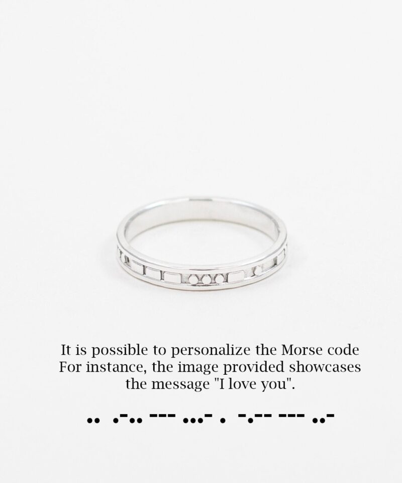 A delicate sterling silver ring engraved with Morse code that spells 