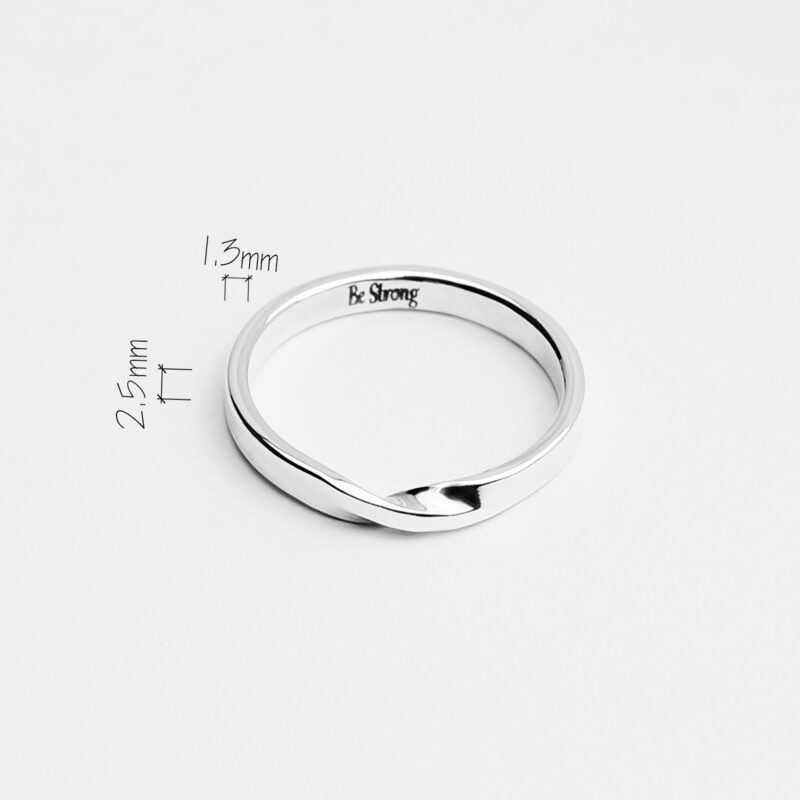 A minimalist 925 sterling silver twisted rope ring is displayed on a clean white background. The band has a subtle twist detail at the front, symbolizing strength and resilience, with a tiny “Be Strong” engraving delicately etched on the inner side. The ring's sleek polish and fine proportions highlight its modern simplicity, making it a meaningful yet understated everyday accessory or thoughtful gift.