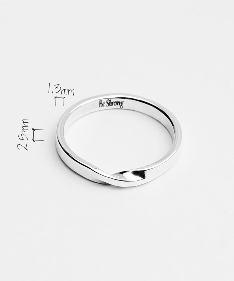 A minimalist 925 sterling silver twisted rope ring is displayed on a clean white background. The band has a subtle twist detail at the front, symbolizing strength and resilience, with a tiny “Be Strong” engraving delicately etched on the inner side. The ring's sleek polish and fine proportions highlight its modern simplicity, making it a meaningful yet understated everyday accessory or thoughtful gift.