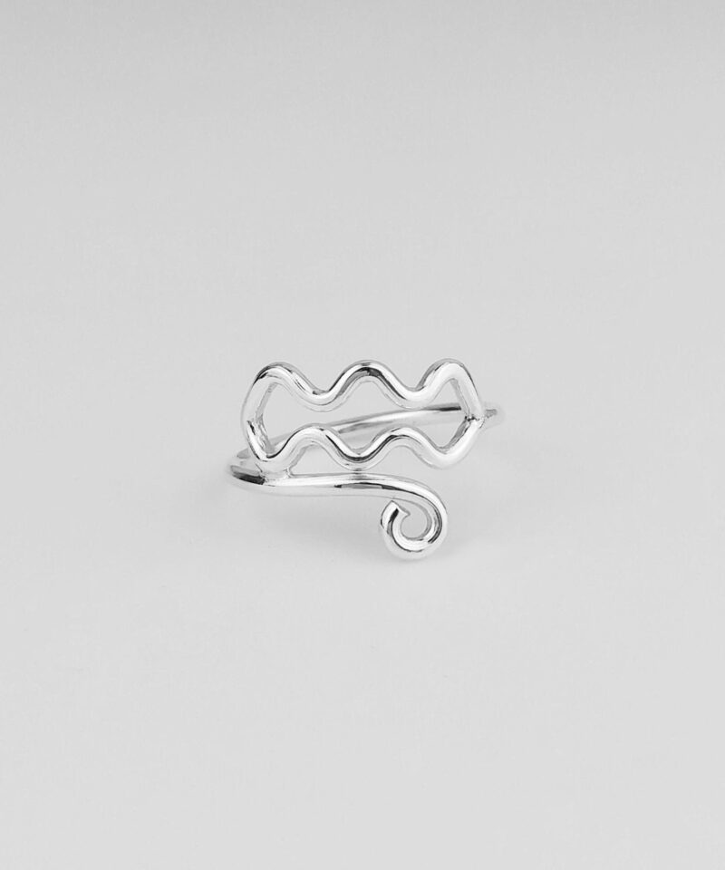 This sterling silver Aquarius ring showcases the iconic wave lines of the zodiac, designed with fluid motion and gentle symmetry. The glossy finish brings out the artistic silhouette, perfect for those who admire celestial symbols and expressive simplicity in everyday jewelry. A graceful statement of individuality and water-sign charm.