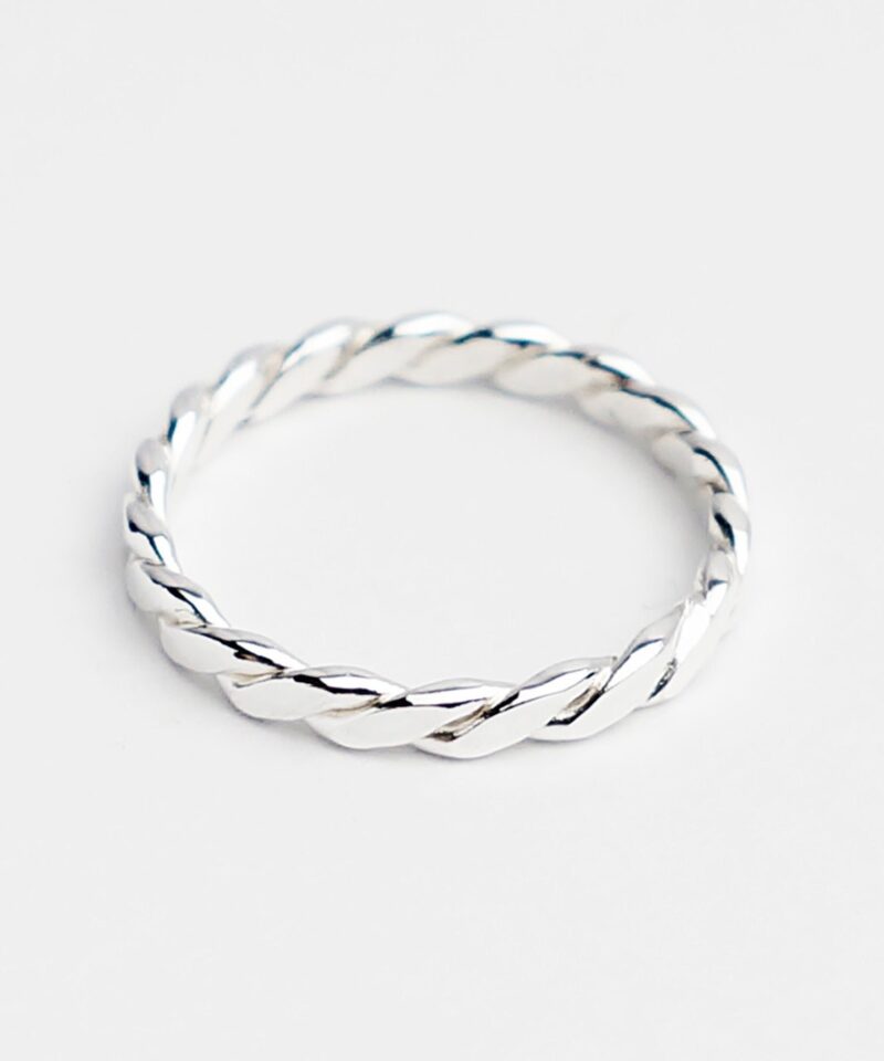 A minimalist classic twisted ring crafted in high-polish 925 sterling silver, featuring an elegant rope-like texture. The smooth twisted band reflects light beautifully and adds subtle detail to a simple silhouette. Perfect as a stacking ring or dainty daily accessory, its design embodies understated charm and timeless craftsmanship.