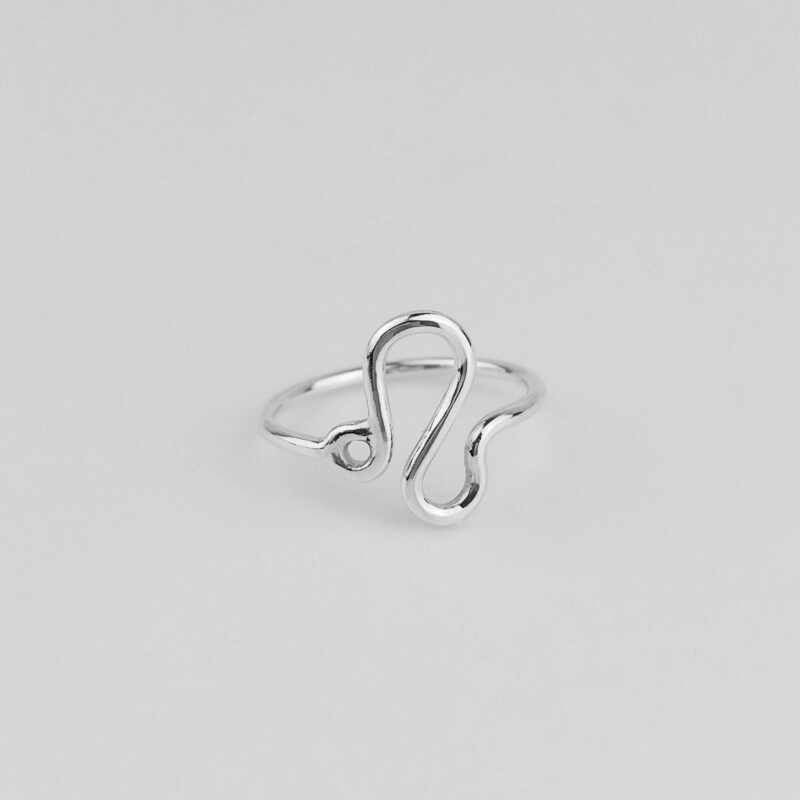 This handcrafted Leo zodiac ring is made from high-quality 925 sterling silver, shaped into the fluid and confident symbol of Leo. Its sleek and minimalist form makes it a versatile piece for everyday wear or celestial gifting. Polished to a soft shine, the design celebrates the strength, passion, and individuality that define this fire sign, perfect for those who lead with heart and courage.
