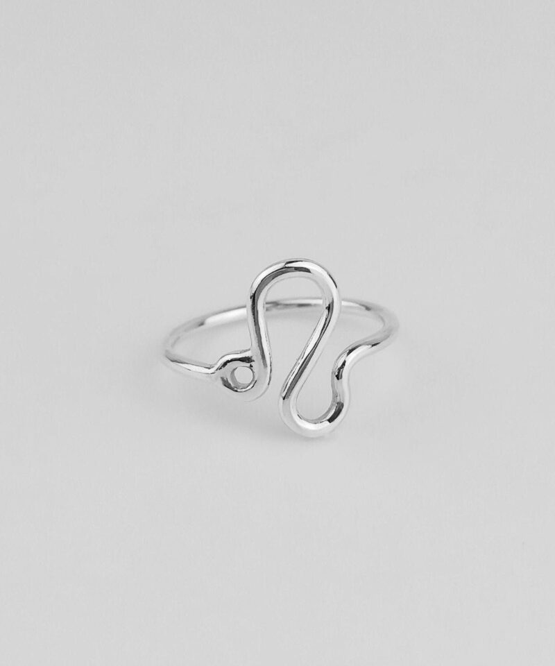 This handcrafted Leo zodiac ring is made from high-quality 925 sterling silver, shaped into the fluid and confident symbol of Leo. Its sleek and minimalist form makes it a versatile piece for everyday wear or celestial gifting. Polished to a soft shine, the design celebrates the strength, passion, and individuality that define this fire sign, perfect for those who lead with heart and courage.