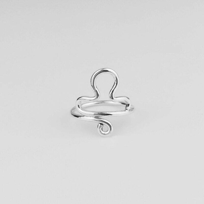 925 sterling silver Libra ring featuring the astrological scales symbol in a sleek wire-formed design. This elegant handmade piece blends minimalist style with personal zodiac meaning, crafted for thoughtful everyday wear or a symbolic gift for Libra-born individuals.