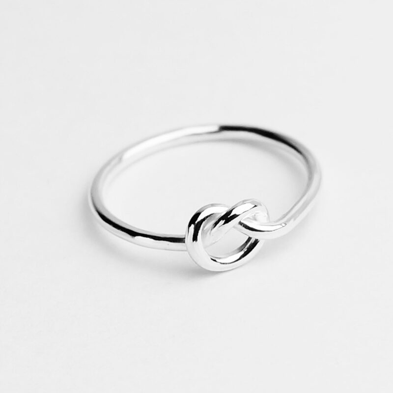 Delicately crafted in polished 925 sterling silver, this love knot ring captures the essence of connection and eternity. Its minimal and modern design features a single flowing knot symbolizing unity and lasting affection — a meaningful token of love or friendship that complements any style with grace and elegance.