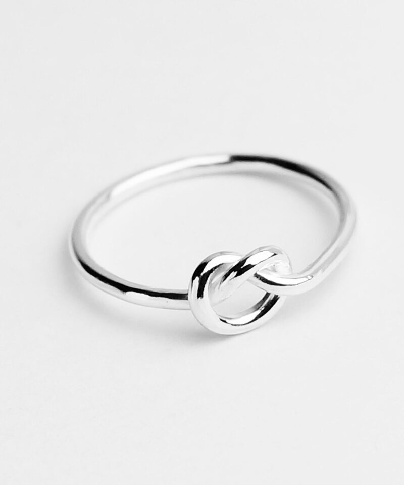 Delicately crafted in polished 925 sterling silver, this love knot ring captures the essence of connection and eternity. Its minimal and modern design features a single flowing knot symbolizing unity and lasting affection — a meaningful token of love or friendship that complements any style with grace and elegance.