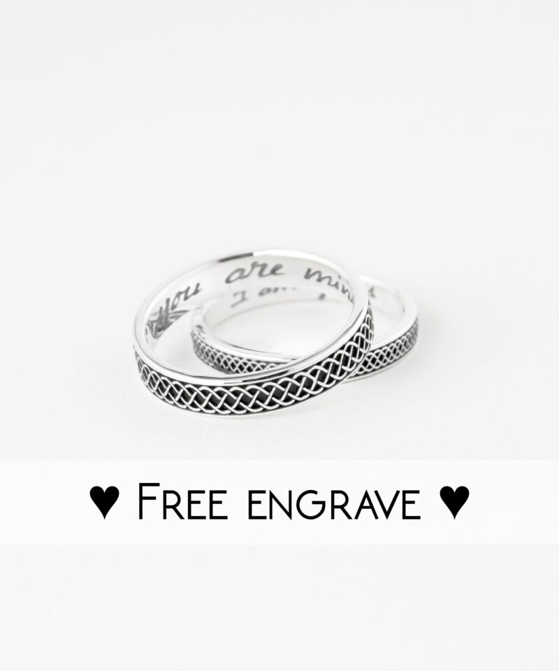 Flat lay of 925 sterling silver Celtic knot rings on white, with 