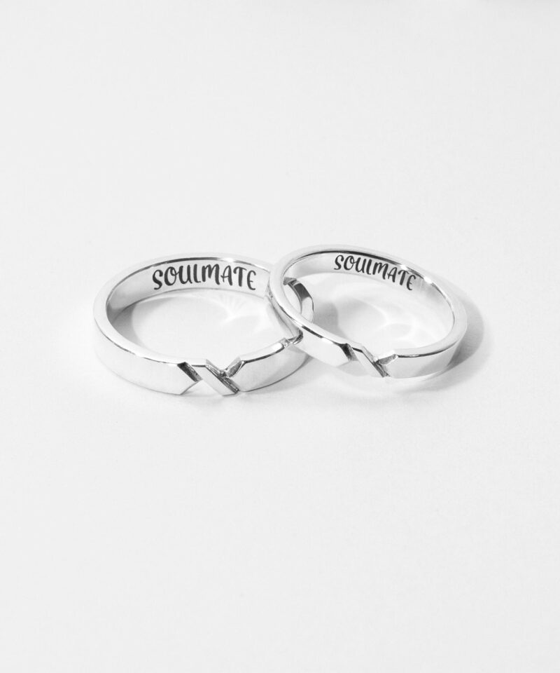 Two minimalist sterling silver couple rings with a connecting V-line detail, elegantly crafted to symbolize an unbreakable bond. These matching rings feature a sleek, polished finish and a subtle notch design that aligns when placed side by side. A meaningful choice for couples, soulmates, or best friends celebrating a special connection. Captured on a clean, white background for a bright, timeless feel.