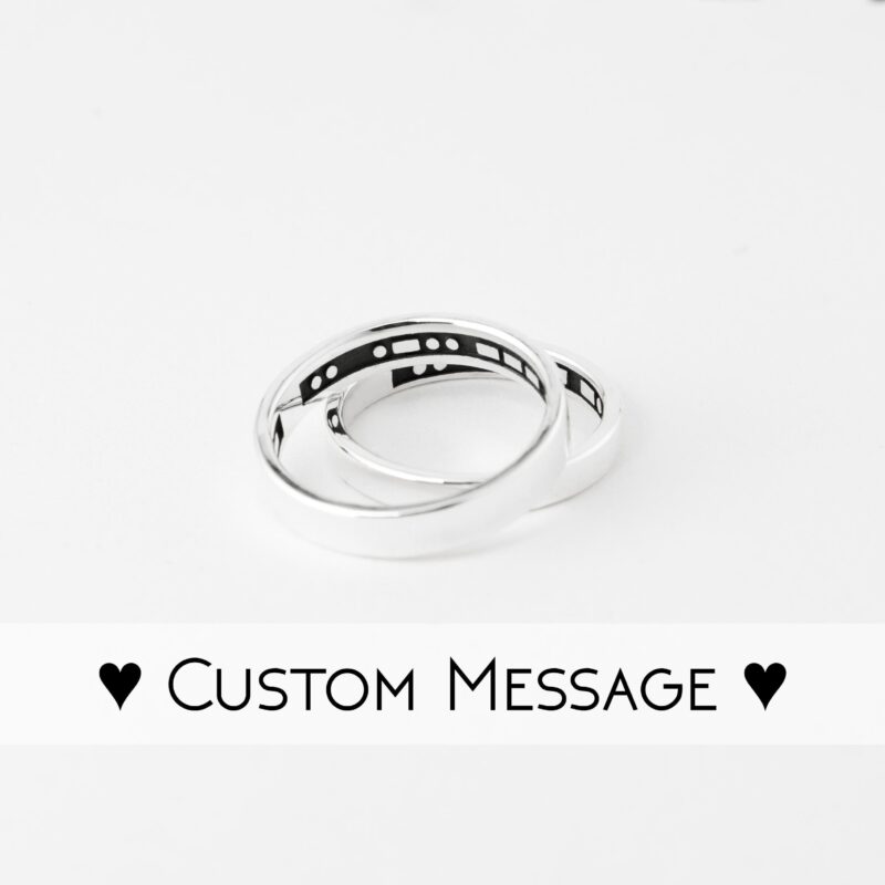 Minimalist sterling silver couple rings featuring hidden Morse code engraving inside the bands. The rings are polished with a sleek, smooth finish on the outside, while the secret Morse code message inside adds a unique and personal touch. Perfect for couples who love discreet yet meaningful jewelry, these handmade silver rings symbolize hidden messages of love and connection. Ideal for promise rings or anniversary gifts.