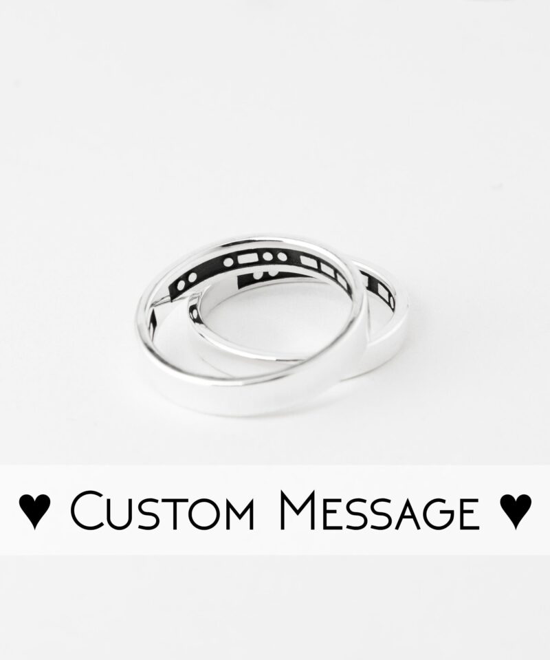 Minimalist sterling silver couple rings featuring hidden Morse code engraving inside the bands. The rings are polished with a sleek, smooth finish on the outside, while the secret Morse code message inside adds a unique and personal touch. Perfect for couples who love discreet yet meaningful jewelry, these handmade silver rings symbolize hidden messages of love and connection. Ideal for promise rings or anniversary gifts.
